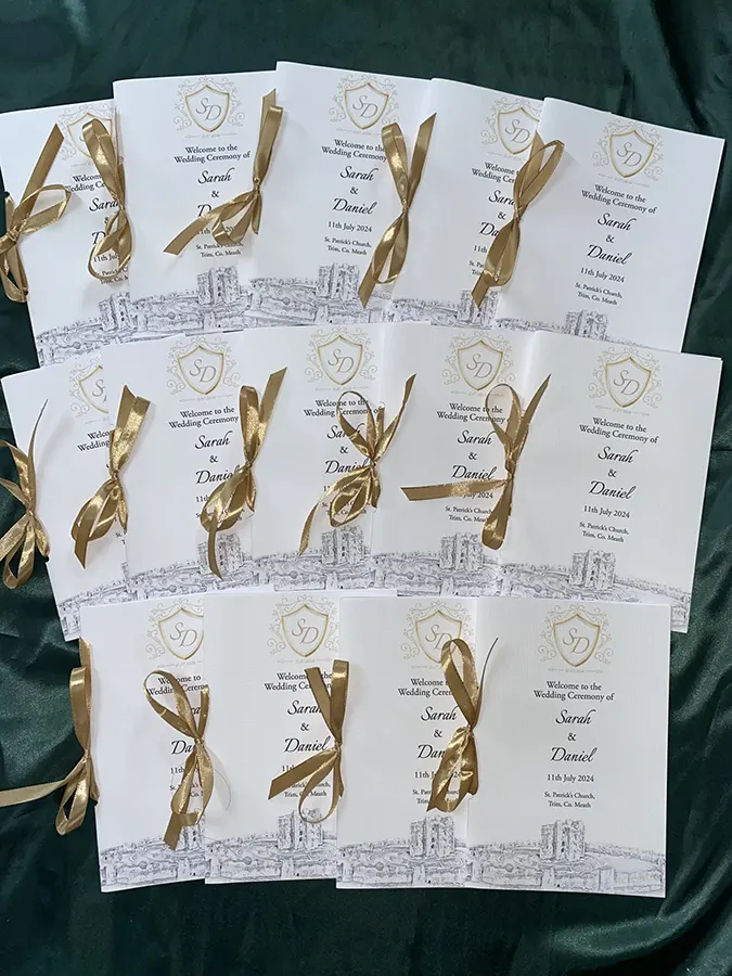 Full Folded Mass Booklets Tied in Gold Ribbon